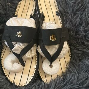 Used DKNY black leather slip on sandals size 11